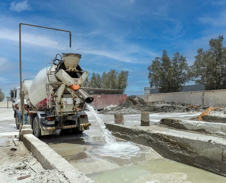 Concrete Mixer unloading wastewater to raw water pit